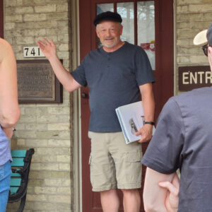 Stroll 'n Tell leader Mike Davis in front of Rowley Museum.